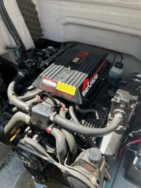 Slide: The Image of Engine of a 1995 Chaparral 220 Sunseta boat, featuring a MerCruiser motor. - 7