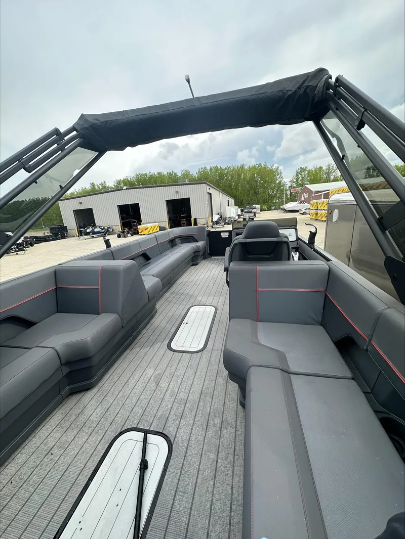 Slide: The Image of 2023 Manitou Explore boat with spacious seating and modern design. - 7