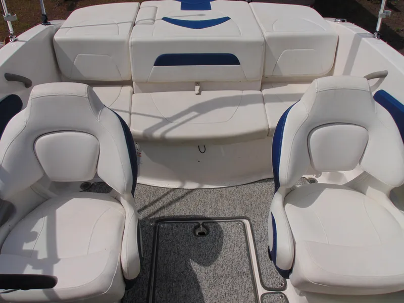 Slide: The Image of 2015 Chaparral 18 H2O Sport boat interior with white and blue seating. - 11