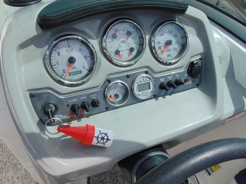 Slide: The Image of Dashboard of a 2015 Chaparral 18 H2O Sport boat with gauges and controls. - 16