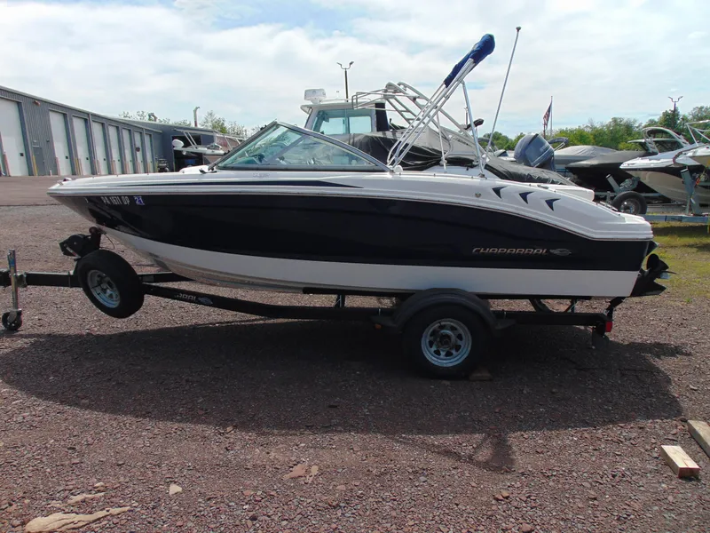 Slide: The Image of 2015 Chaparral 18 H2O Sport boat on trailer, parked outdoors. - 3