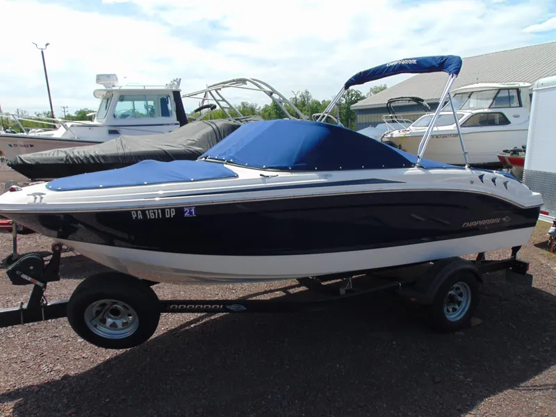 Slide: The Image of 2015 Chaparral 18 H2O Sport boat on trailer with blue cover and canopy. - 4