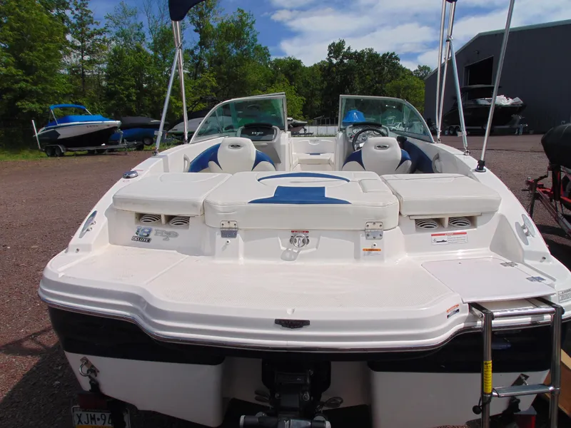 Slide: The Image of 2015 Chaparral 18 H2O Sport boat, rear view, in outdoor setting. - 5