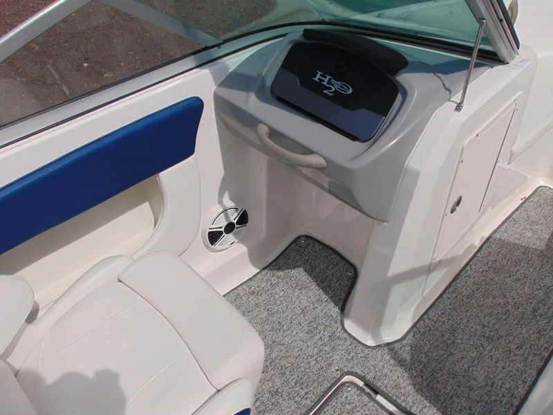 Slide: The Image of 2015 Chaparral 18 H2O Sport boat interior with seating and dashboard details. - 8