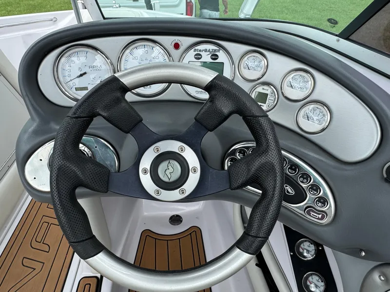 Slide: The Image of Steering wheel and dashboard of 2007 Nautique Super Air Nautique 230 boat. - 11