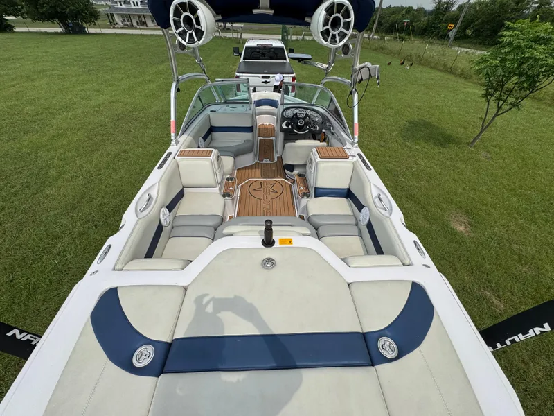 Slide: The Image of 2007 Nautique Super Air Nautique 230 boat interior with seating and speakers. - 19