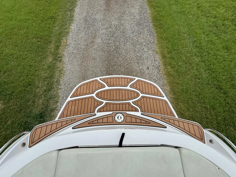 Slide: The Image of 2007 Nautique Super Air Nautique 230 boat deck with teak finish. - 21