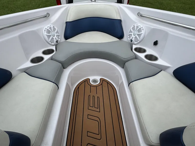 Slide: The Image of 2007 Nautique Super Air Nautique 230 boat interior with cushioned seating and cup holders. - 5