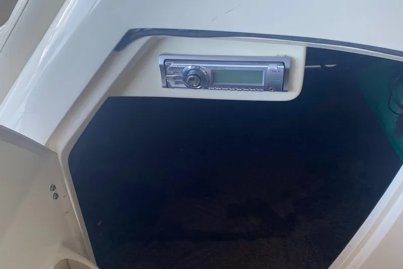 Slide: The Image of 2012 Bennington R22 boat interior with built-in stereo system. - 12