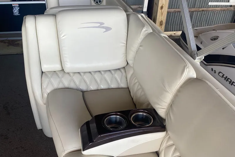Slide: The Image of Luxurious seating on 2012 Bennington R22 boat with cup holders and quilted upholstery. - 4
