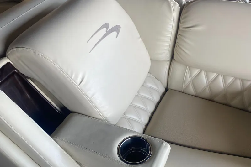 Slide: The Image of Luxurious beige seating with cup holder in 2012 Bennington R22 boat. - 8