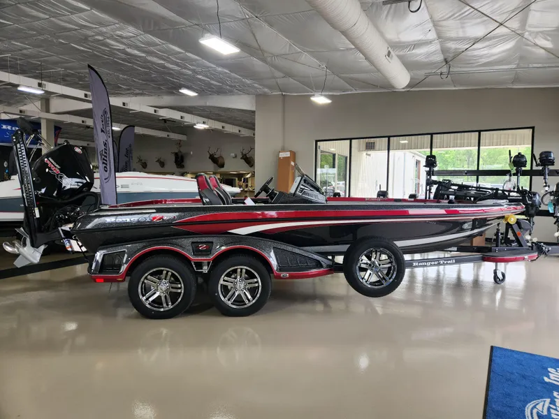 Slide: The Image of 2025 Ranger Z520R Cup-Equipped boat displayed in a showroom, featuring sleek design and modern features. - 0