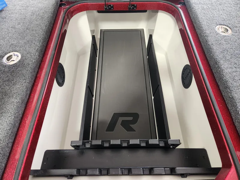 Slide: The Image of 2025 Ranger Z520R Cup-Equipped storage compartment with sleek design and logo. - 10