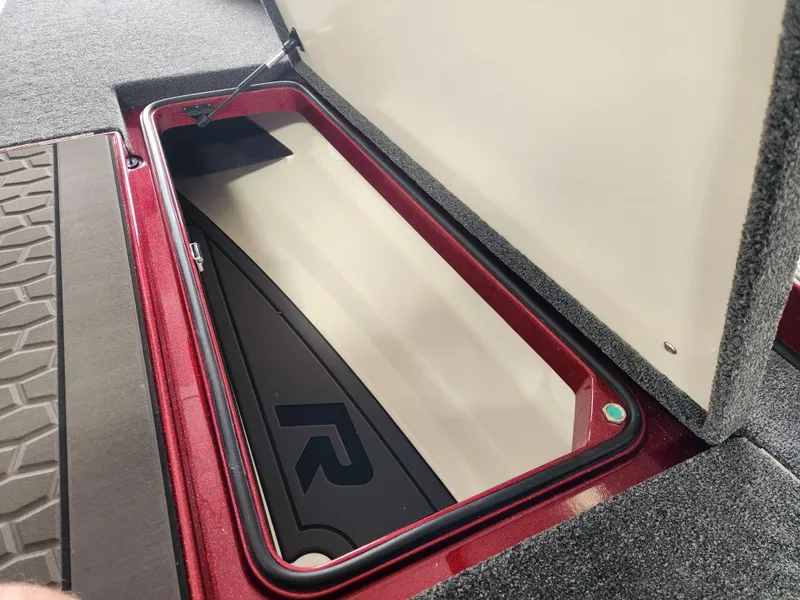 Slide: The Image of 2025 Ranger Z520R Cup-Equipped storage compartment with open lid, showcasing interior design. - 11