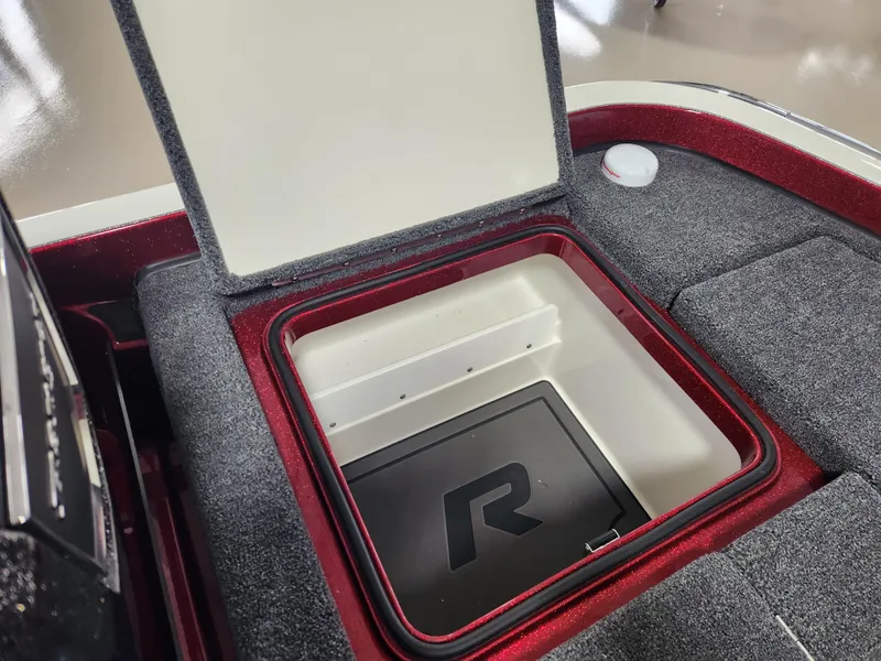 Slide: The Image of 2025 Ranger Z520R Cup-Equipped storage compartment with open lid, showcasing interior design. - 20