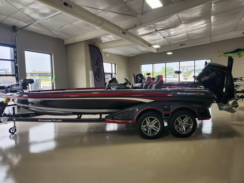 Slide: The Image of 2025 Ranger Z520R Cup-Equipped boat in showroom, sleek design, dual-axle trailer. - 5