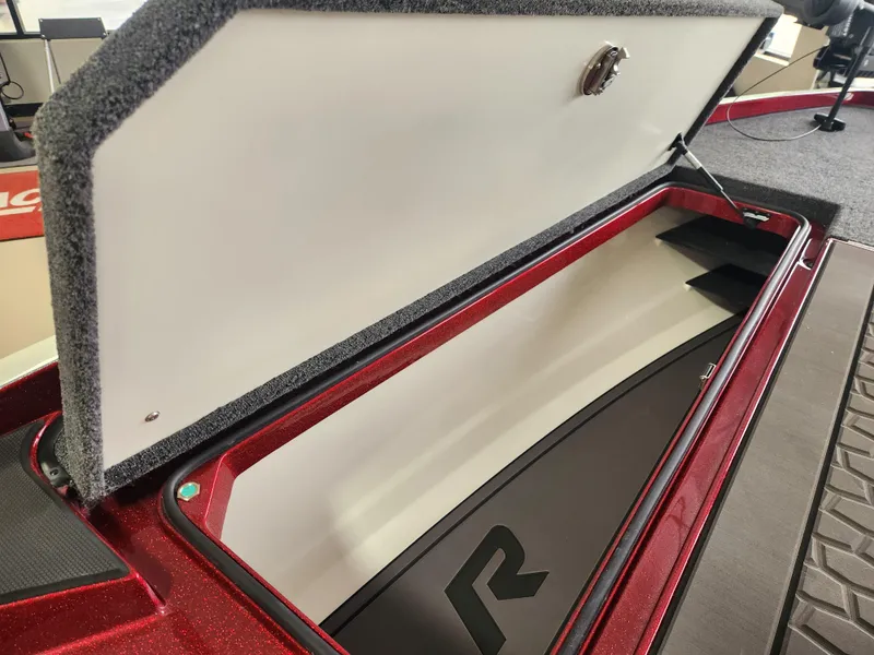 Slide: The Image of 2025 Ranger Z520R Cup-Equipped boat storage compartment, open lid, red interior detailing. - 9