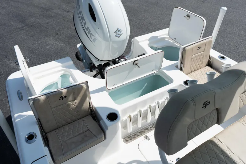 Slide: The Image of 2023 Sea Pro 208 Bay boat interior with seating and storage compartments. - 11