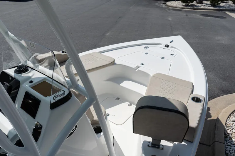 Slide: The Image of 2023 Sea Pro 208 Bay boat interior with seating and console. - 17
