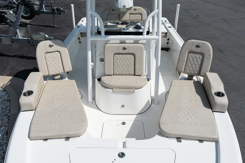 Slide: The Image of 2023 Sea Pro 208 Bay boat interior with beige cushioned seating and sleek design. - 18