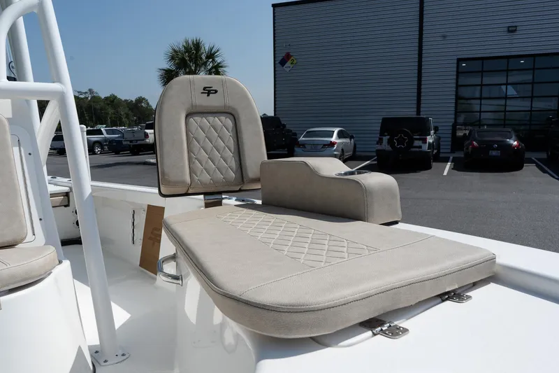 Slide: The Image of 2023 Sea Pro 208 Bay boat with beige seating, parked outdoors. - 19