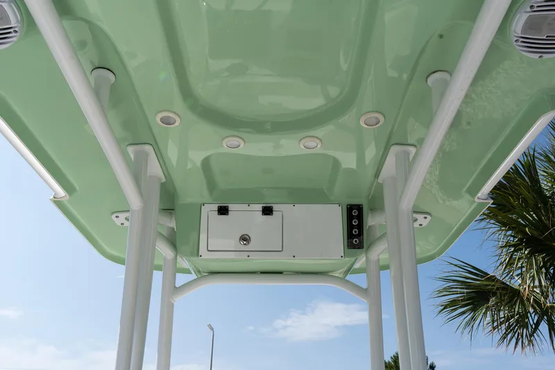 Slide: The Image of 2023 Sea Pro 208 Bay boat canopy with integrated lights and storage, viewed from below. - 20