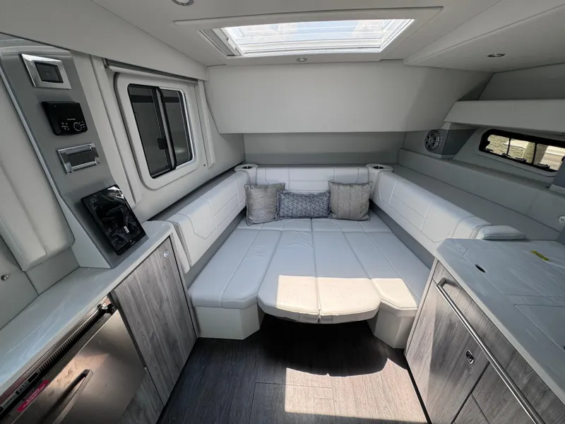 Slide: The Image of 2020 Formula 430 Super Sport Crossover interior with modern seating and skylight. - 11