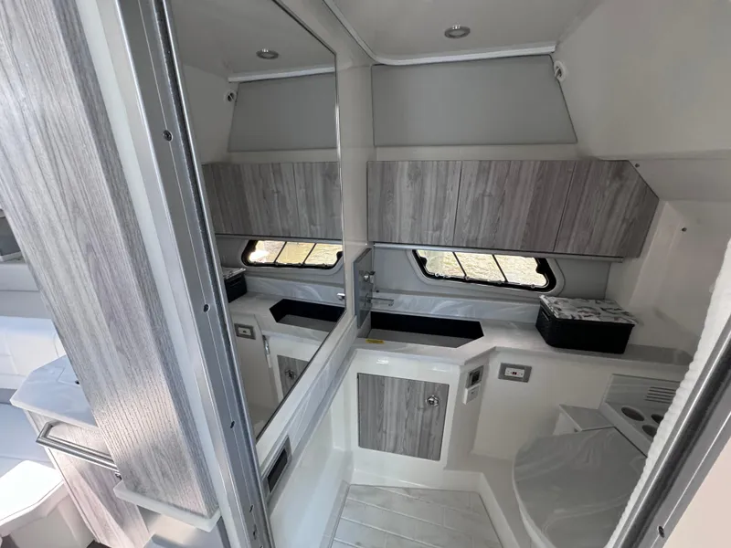 Slide: The Image of 2020 Formula 430 Super Sport Crossover bathroom with modern design and wood accents. - 15