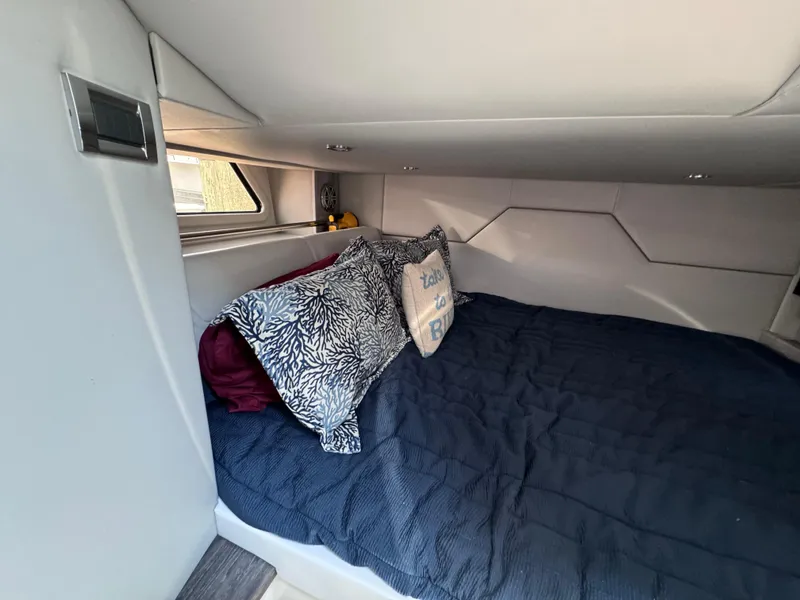 Slide: The Image of Cozy cabin interior of 2020 Formula 430 Super Sport Crossover with bed and pillows. - 16
