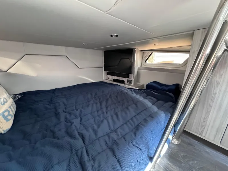 Slide: The Image of 2020 Formula 430 Super Sport Crossover cabin with bed, TV, and window. - 17