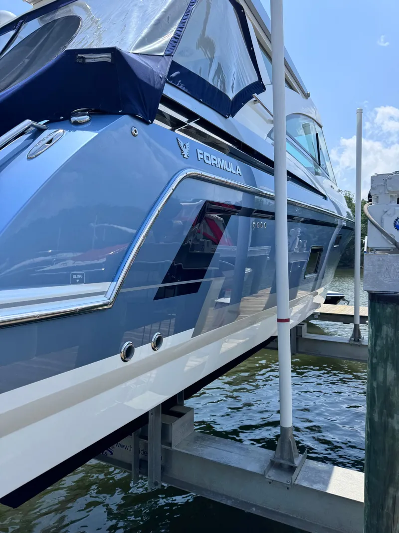 Slide: The Image of 2020 Formula 430 Super Sport Crossover yacht docked at marina, side view. - 2