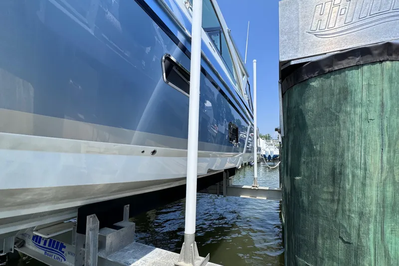 Slide: The Image of 2020 Formula 430 Super Sport Crossover docked at marina, side view. - 3
