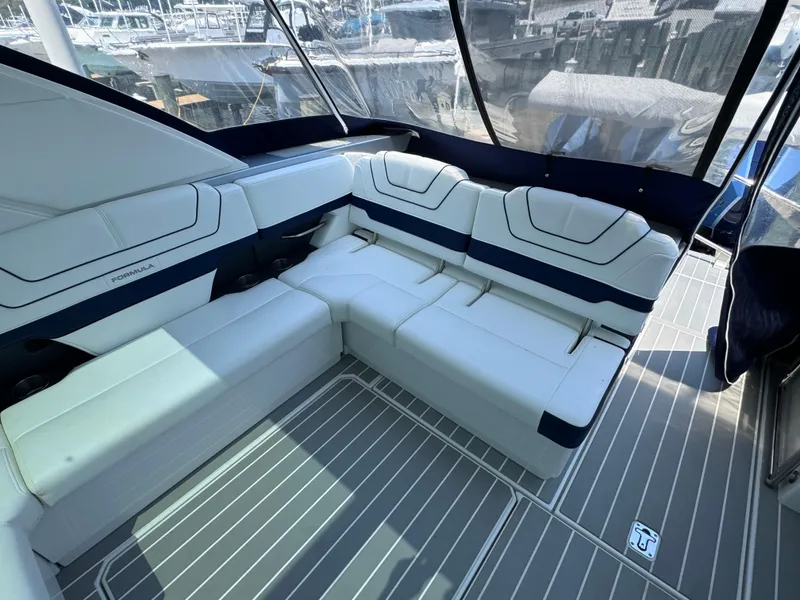 Slide: The Image of 2020 Formula 430 Super Sport Crossover boat interior with white seating and sleek design. - 6