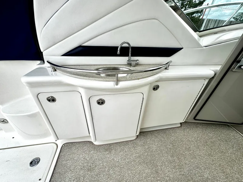 Slide: The Image of 2010 Sea Ray 40 Sundancer yacht interior with sink and storage cabinets. - 16