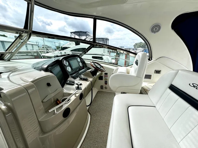 Slide: The Image of Interior of 2010 Sea Ray 40 Sundancer yacht with modern helm and seating. - 19