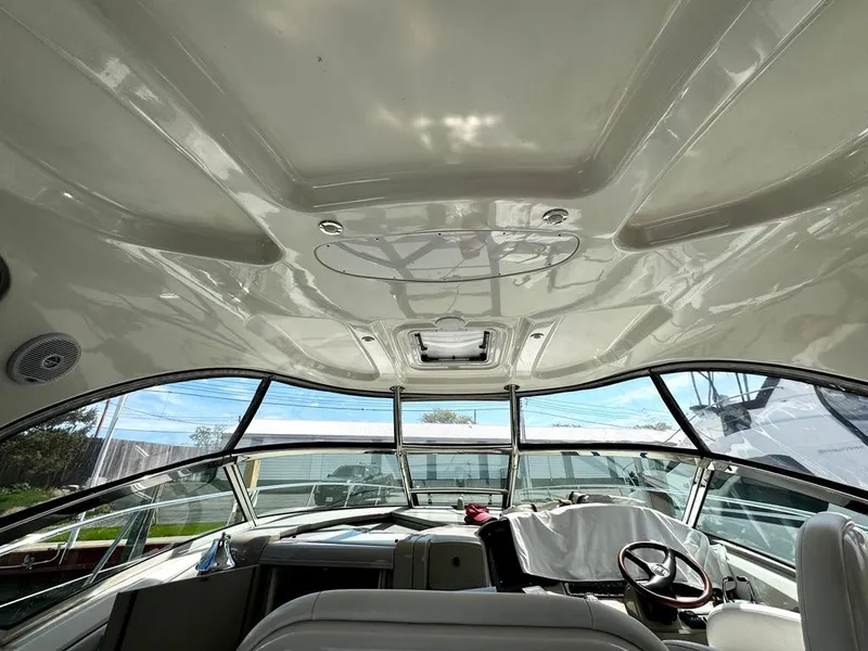 Slide: The Image of Interior view of 2010 Sea Ray 40 Sundancer yacht cockpit with panoramic windows. - 24