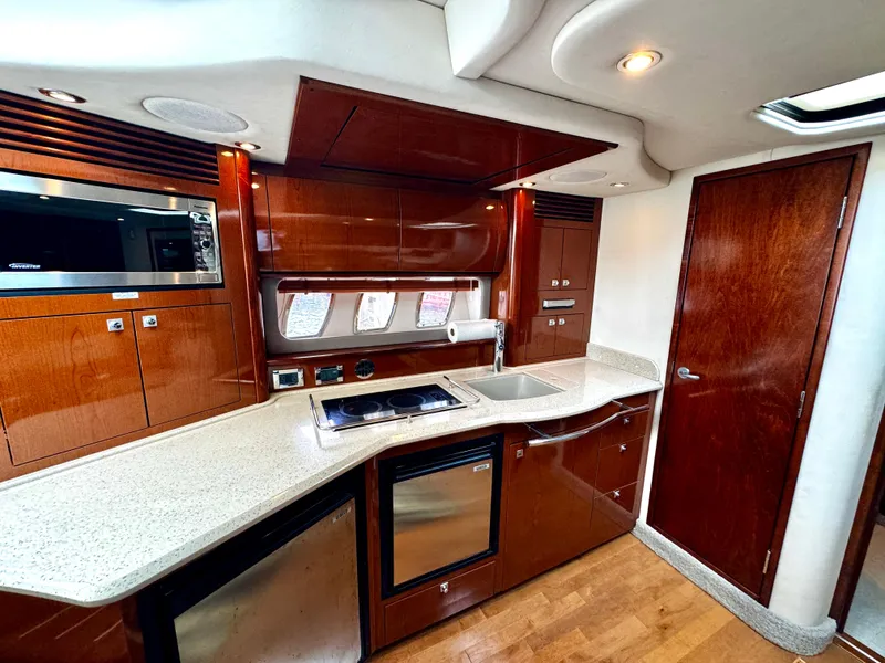 Slide: The Image of Luxurious kitchen interior of 2010 Sea Ray 40 Sundancer yacht with modern appliances. - 29