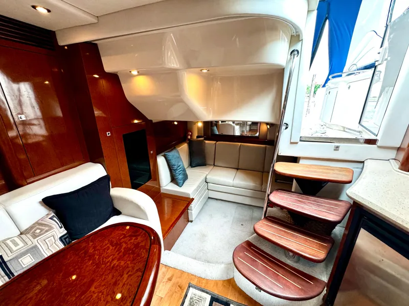 Slide: The Image of Luxurious interior of 2010 Sea Ray 40 Sundancer yacht with elegant seating and wooden accents. - 33