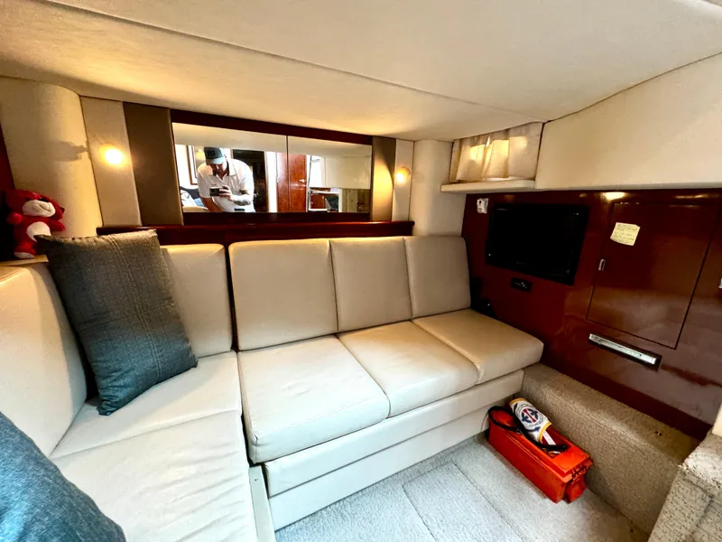 Slide: The Image of Interior of 2010 Sea Ray 40 Sundancer yacht with beige seating and modern amenities. - 34