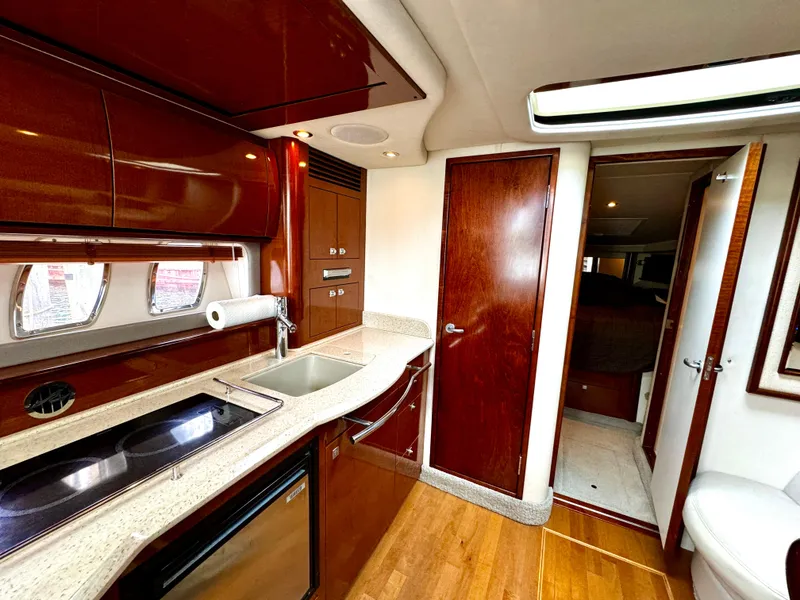 Slide: The Image of Luxurious interior of 2010 Sea Ray 40 Sundancer yacht with modern kitchen amenities. - 35