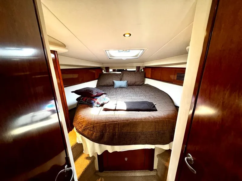 Slide: The Image of Luxurious cabin interior of 2010 Sea Ray 40 Sundancer yacht with cozy bed. - 36