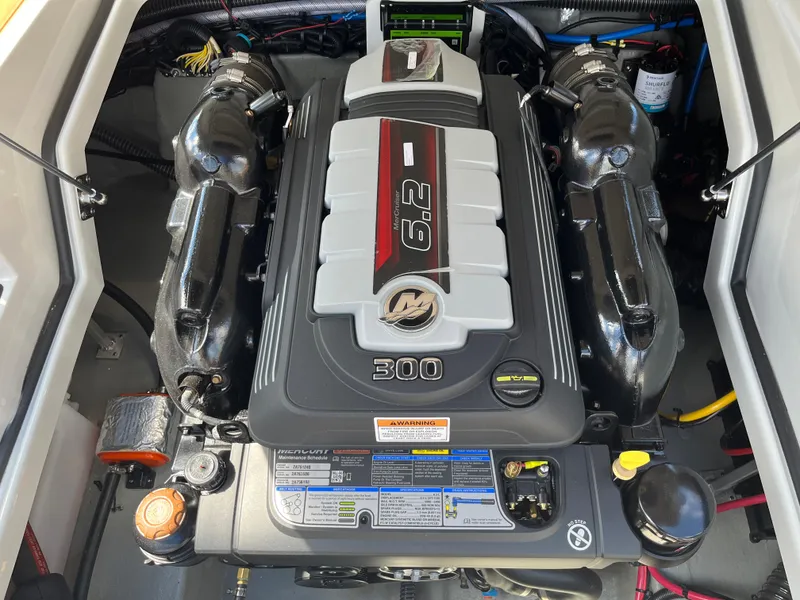 Slide: The Image of 2024 Crownline Eclipse E255 engine, featuring a 6.2L V8 with 300 horsepower. - 12