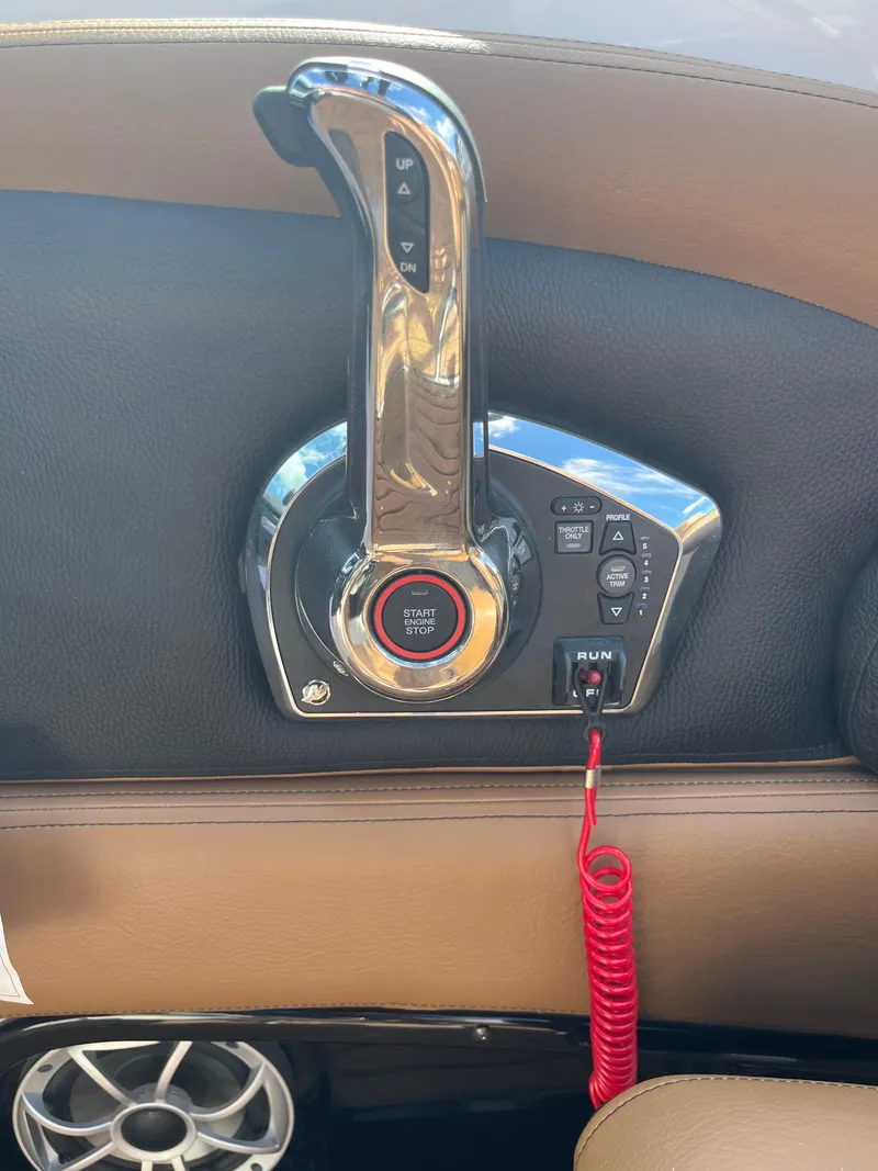 Slide: The Image of 2024 Crownline Eclipse E255 boat throttle control with red coiled cord. - 18