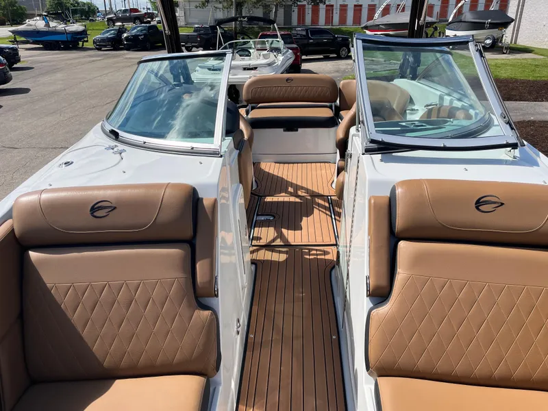 Slide: The Image of 2024 Crownline Eclipse E255 boat with tan leather seats and sleek design. - 3