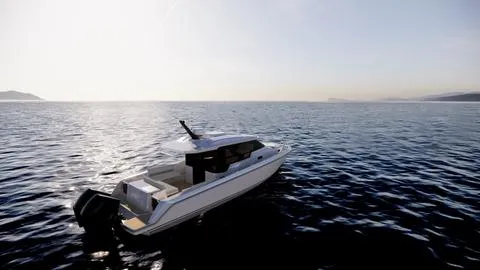 The Image of 2025 Oryx 32 LX boat cruising on calm ocean waters at sunset. - 1