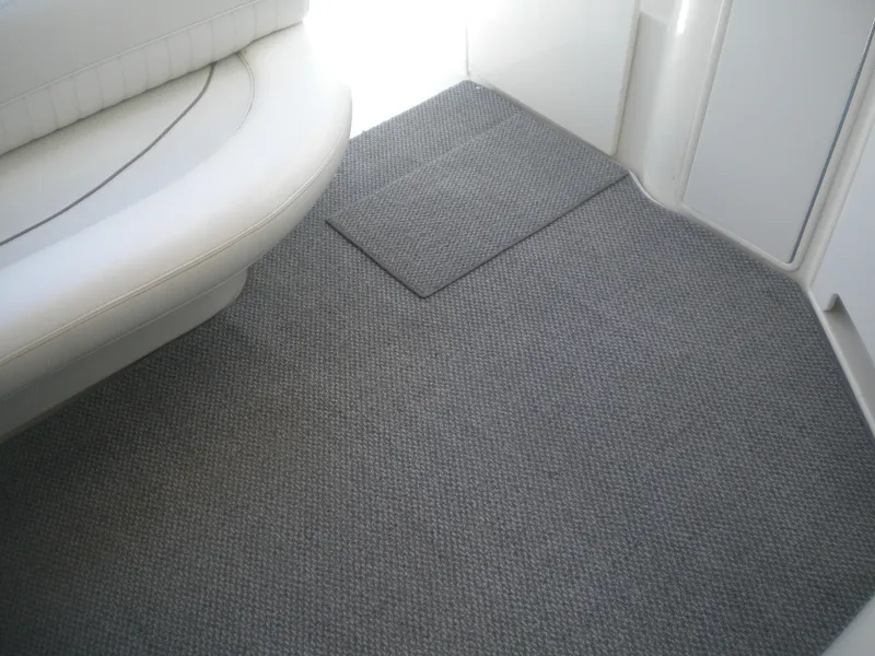 Slide: The Image of 1998 Cruisers 3870 Express interior with gray carpet and white seating. - 17