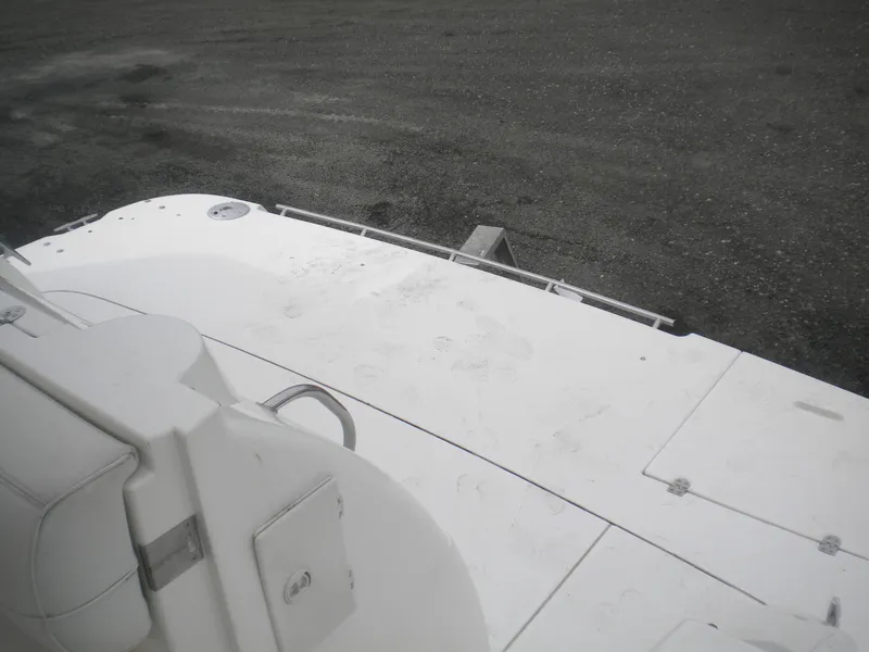 Slide: The Image of 1998 Cruisers 3870 Express boat deck, white surface, outdoor setting. - 41