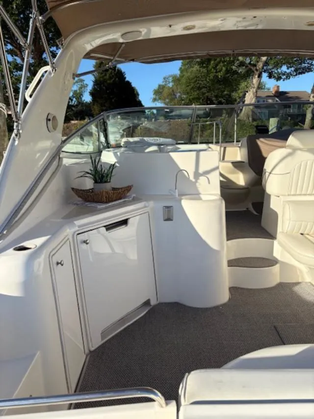 Slide: The Image of 1998 Cruisers 3870 Express boat interior with seating and cabinetry. - 10