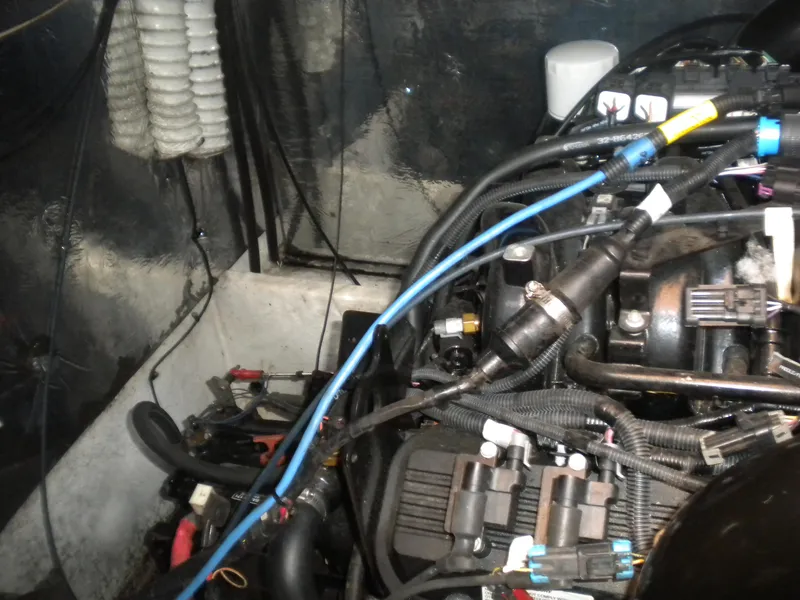 Slide: The Image of Engine compartment of a 1998 Cruisers 3870 Express boat, showing wiring and components. - 46