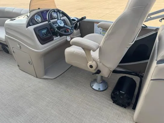 Slide: The Image of Captain's seat and dashboard of a 2019 South Bay 521RS 3.0 pontoon boat. - 4